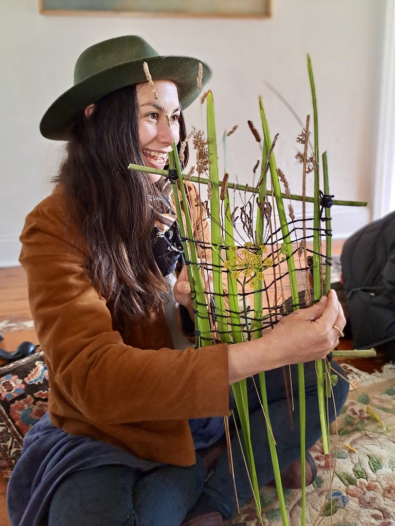 Rachael Harrex showing her woven plant wall-hanging 
