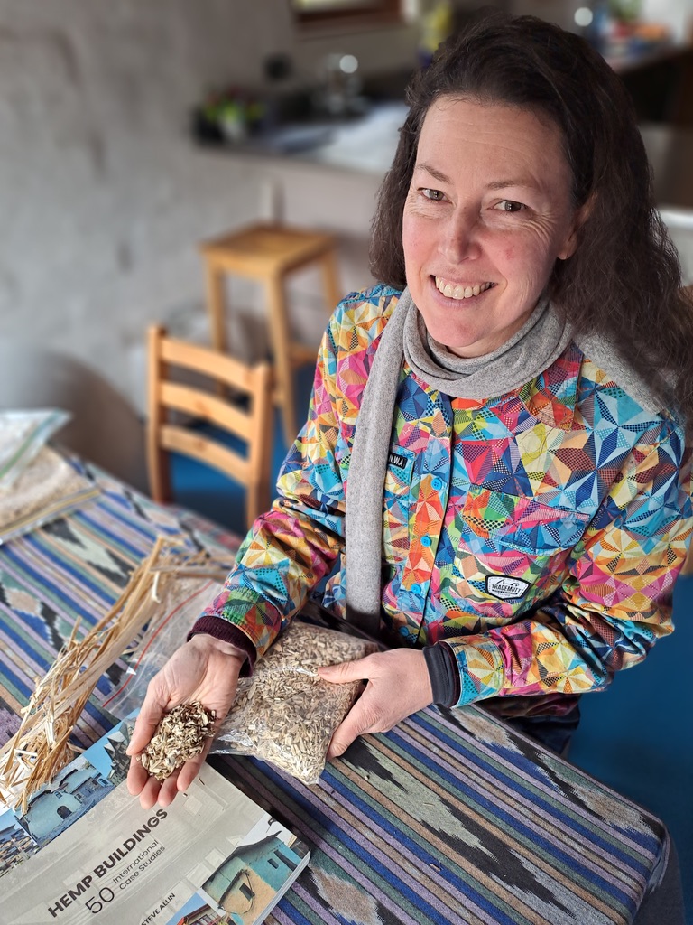 Kirstie holding hemp hurds used to make hempcrete