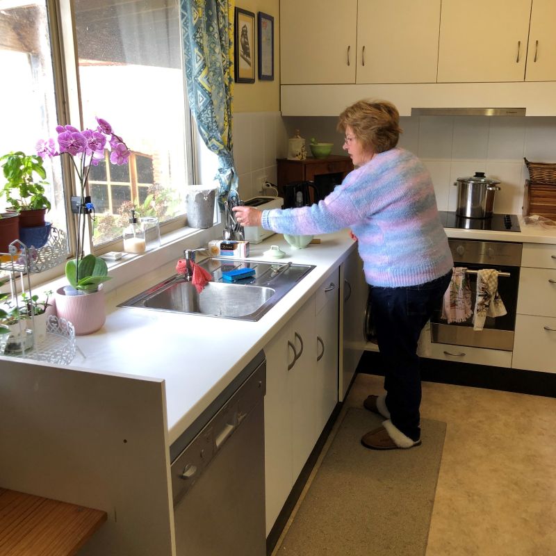 An older woman in her kitchen in the Blue Mountains